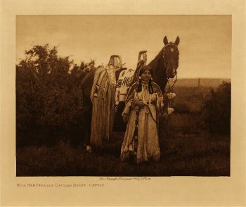 With her proudly decked horse (Cayuse) 1910