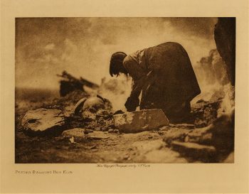 Potter building her kiln 1906