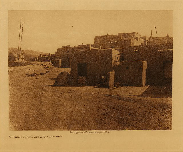 A corner of Taos and a kiva entrance 1925