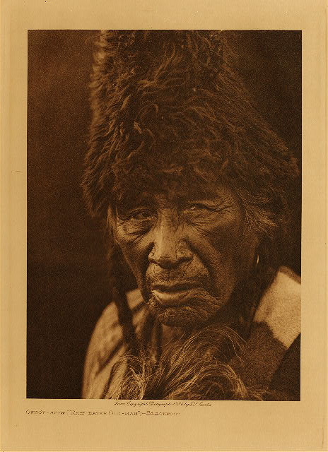 Oksoy-Apiw ("Raw-eater Old-man") (Blackfoot) 1926