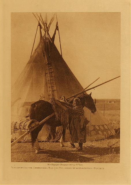 Transporting the ceremonial bag and tipi-cover of a Blackfoot society 1926