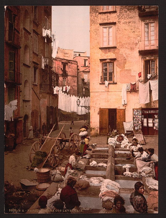 Street with washerwoman, Naples, Italy