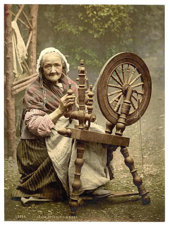 Irish Spinner and Spinning Wheel. Co. Galway, Ireland