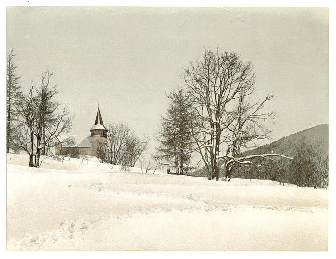 Winter scene with church in background