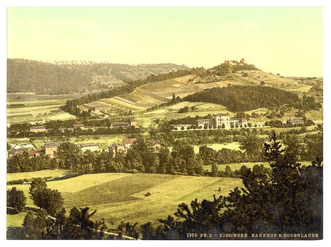 Bad Kissengen (i.e. Bad Kissingen) railway station and the Bodenlaube, seen from the Altenberg, Bavaria, Germany