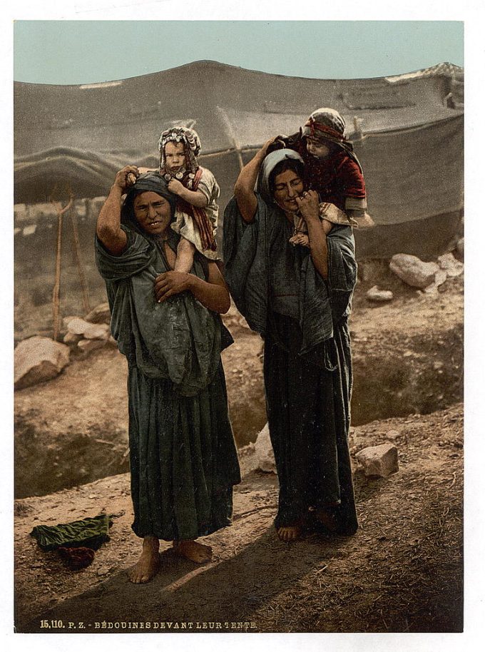 Bedouins and children outside tent, Holy Land